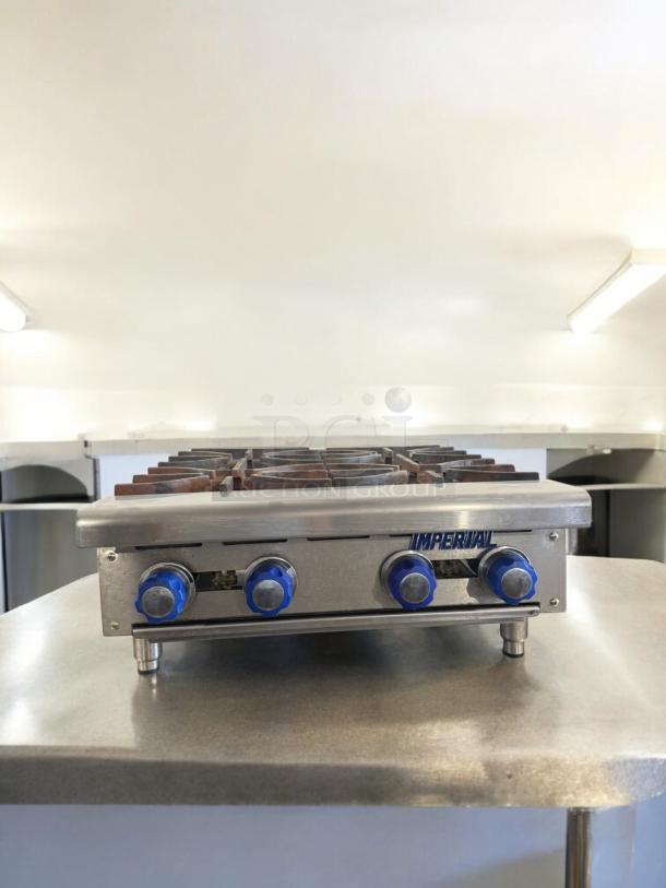 Imperial 4-burner gas hot plate, excellent condition, natural gas, tested and working, blue knobs, stainless steel body.