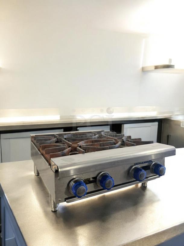 Imperial 4-burner gas hot plate in excellent condition. Natural gas model, fully tested, blue control knobs.