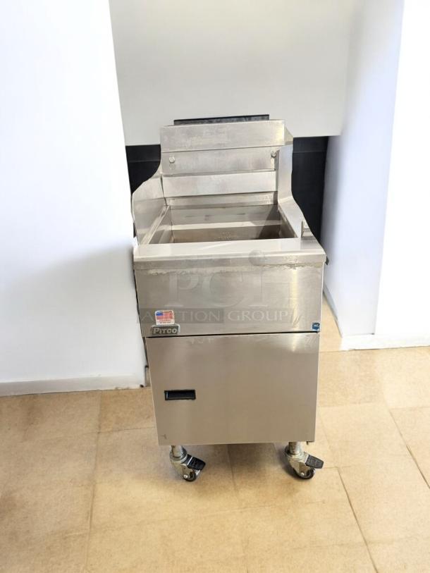 Pitco SG18 natural gas fryer, floor model, excellent condition. Fully tested and working with visible logo and wheels.