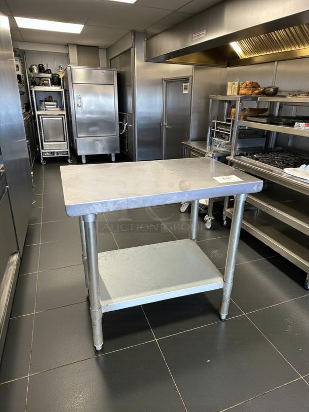Stainless steel work table with undershelf by Standard Commercial, model Prep/Utility. Excellent condition, fully tested.