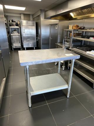 Stainless steel work table with undershelf by Standard Commercial, model Prep/Utility. Excellent condition, fully tested.