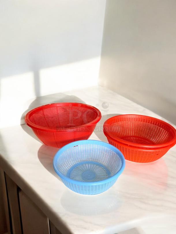 Set of 3 plastic basket strainers in excellent condition, fully tested. Includes red and blue strainers in varying sizes.