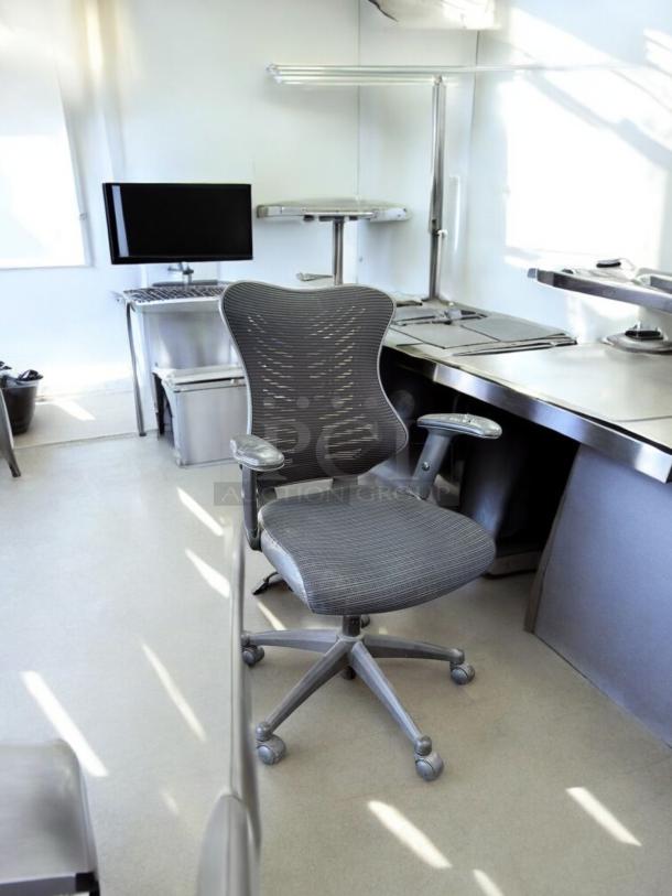 Ergonomic mesh office chair with adjustable armrests in excellent condition. Fully tested and functional.