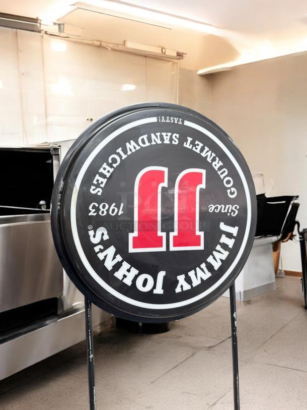 Jimmy John’s double-sided illuminated sign, excellent condition, electric, fully tested and working, round with logo.