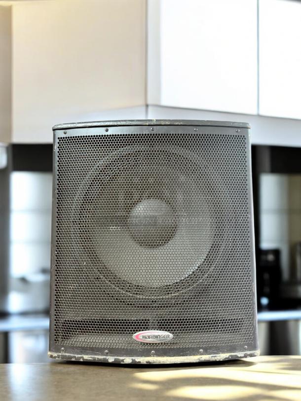 Harbinger HP118S powered subwoofer, excellent condition, 700W, fully tested. Brand logo visible on front grille.