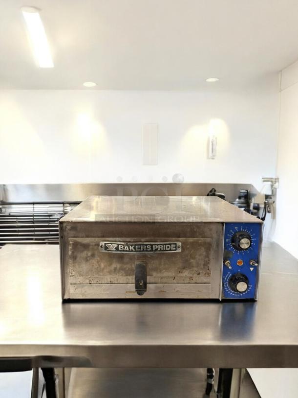 Bakers Pride PX14 countertop pizza oven in excellent condition, 120V, fully tested, with control knobs and logo on the front.
