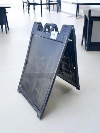 Black Signicade Deluxe Plastic A-Frame Sign, 24"x36", excellent condition, durable construction, ideal for sidewalk displays.