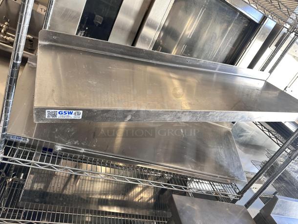 GSW stainless steel wall shelf, 48" wide, excellent condition, model WS-W1448, NSF certified, ETL label visible.