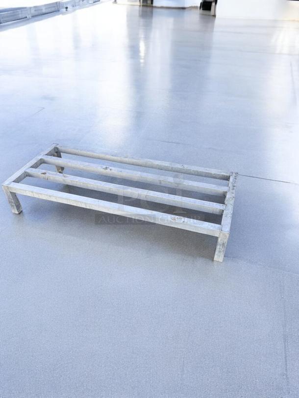 Heavy-duty aluminum dunnage rack, 60" x 20" x 12", excellent condition, fully tested and working. Ideal for storage needs.