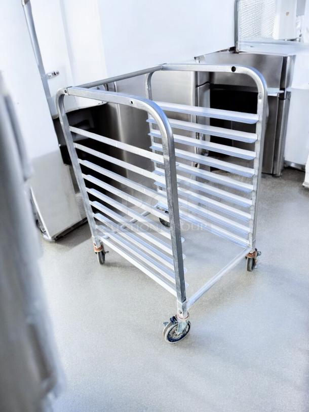 Mobile aluminum 10-slot pan rack with casters in excellent condition. Commercial quality, fully tested and working.