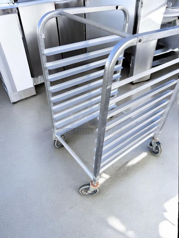 Commercial Quality aluminum 10-slot pan rack with casters. In excellent condition, fully tested, mobile design.