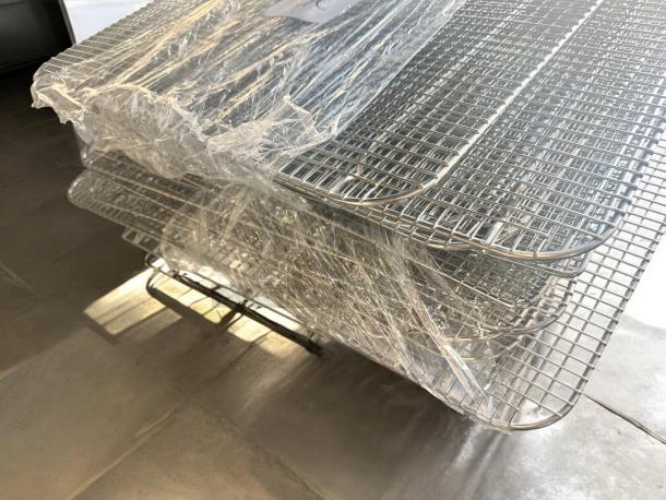 Commercial Grade stainless steel cooling/baking racks, NSF certified, 20-pack. Excellent condition, fully tested, wrapped for protection.