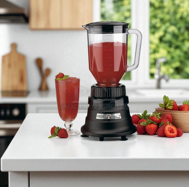 Waring BB150 Commercial Blender in black, 120V, with clear jar and control panel, set on a kitchen counter.