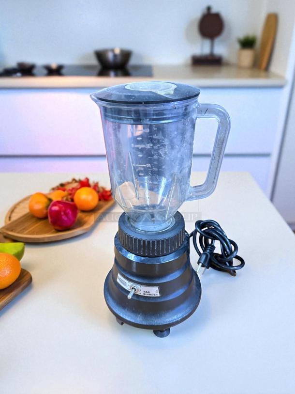 Waring BB150 Commercial Blender, model VM1127I, 120V, clear pitcher, black base, good condition, visible control switch.