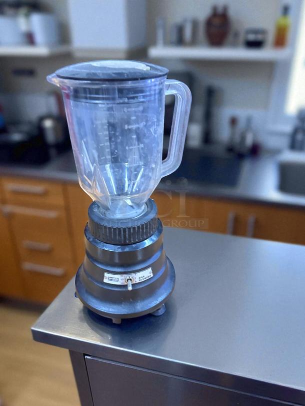 Waring BB150 Commercial Blender, model VM1127I, 120V. Features clear jar with measurement markings. Used condition.