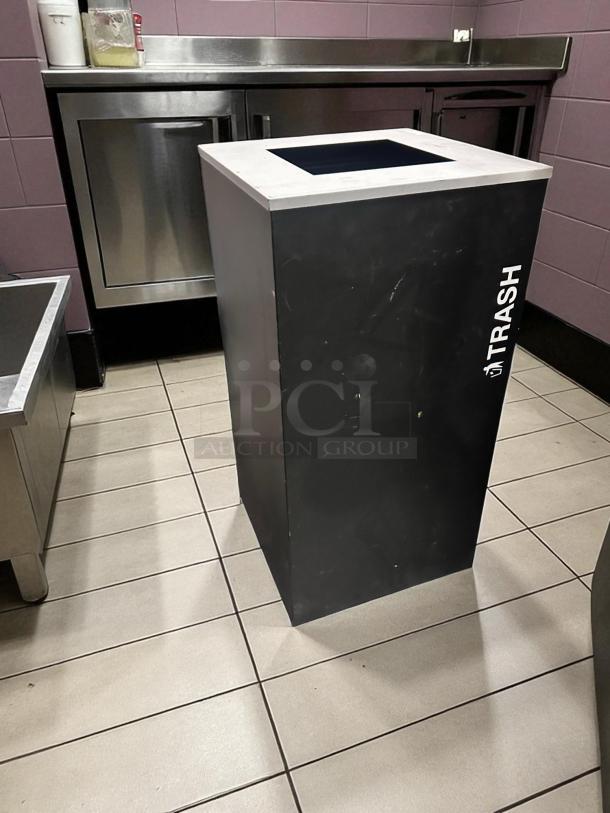 Unbranded commercial trash bin in excellent condition, black with white "TRASH" label. Fully tested, ready for use.