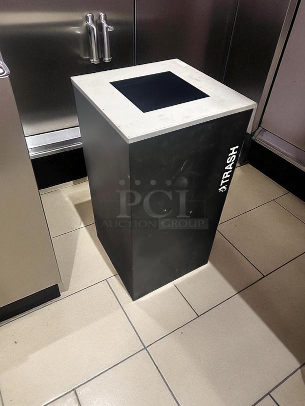 Unbranded commercial trash receptacle in excellent condition, square opening, "TRASH" marked on side, fully tested.