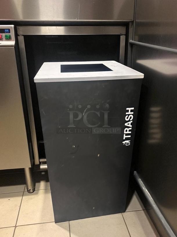 Unbranded commercial trash receptacle in excellent condition, black with "TRASH" label, tested and ready for use.