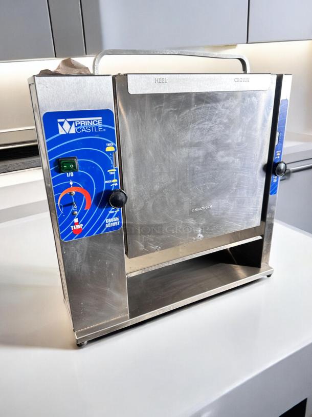 Prince Castle 297-T20 Slim Line Bun Toaster in excellent condition, 115V, stainless steel, fully tested, blue control panel.