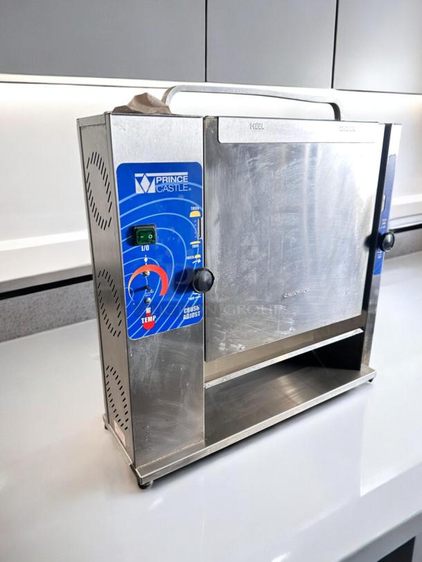 Prince Castle 297-T20 Slim Line Bun Toaster in excellent condition, stainless steel finish, visible controls, 115V, fully tested.
