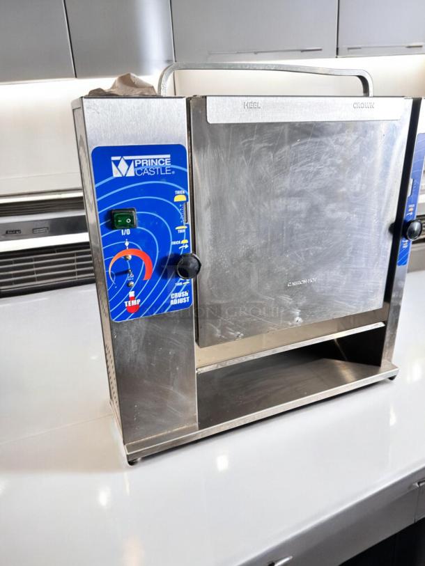 Prince Castle 297-T20 Slim Line Bun Toaster, 115V, excellent condition, tested and working, features temp and crush adjust controls.