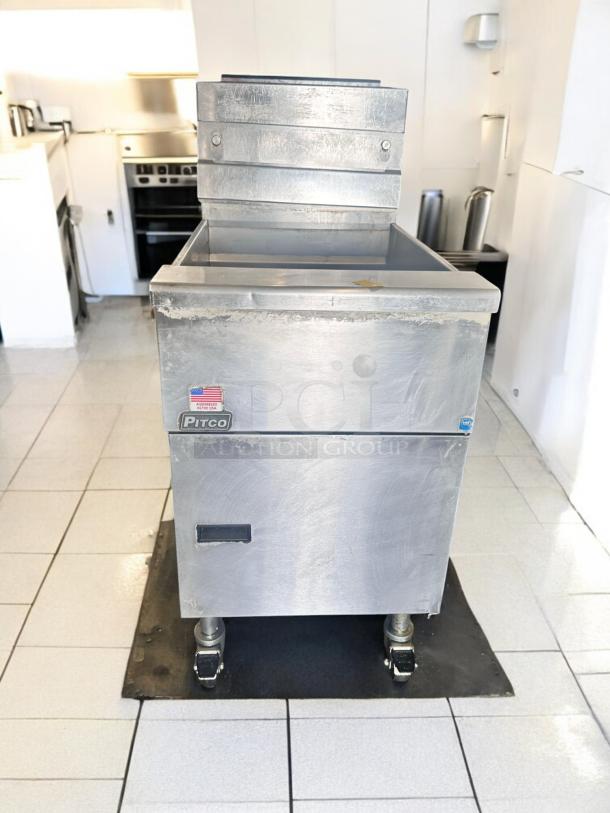 Pitco SG18S gas fryer, excellent condition, 65 lb capacity, natural gas, fully tested, visible branding and safety labels.