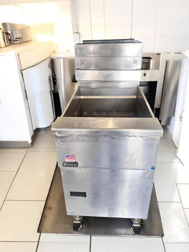 Pitco SG18S gas fryer, 65 lb capacity, excellent condition, natural gas, fully tested, stainless steel, on casters.