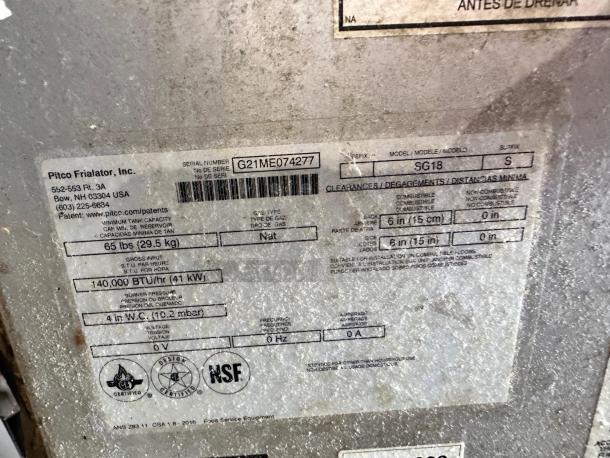 Label close-up of Pitco SG18S gas fryer, showing serial number G21ME074277, 65 lb capacity, 140,000 BTU/hr, NSF certified.
