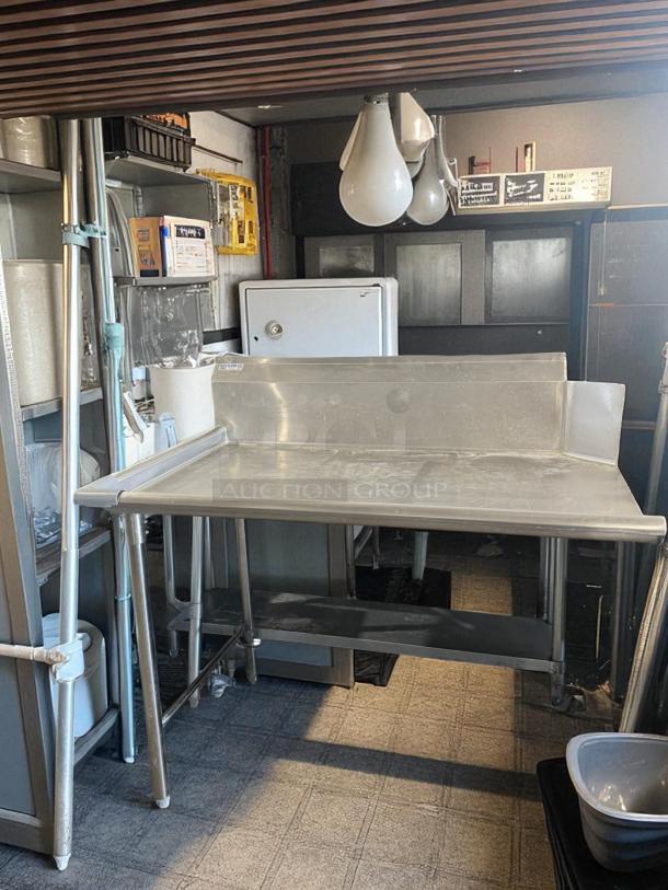 GSW DT-1836-L stainless steel work table, excellent condition, with backsplash, tested and ready for use.