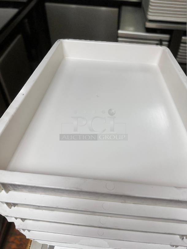 Unbranded commercial dough trays in excellent condition, fully cleaned, stackable design, ready for use.