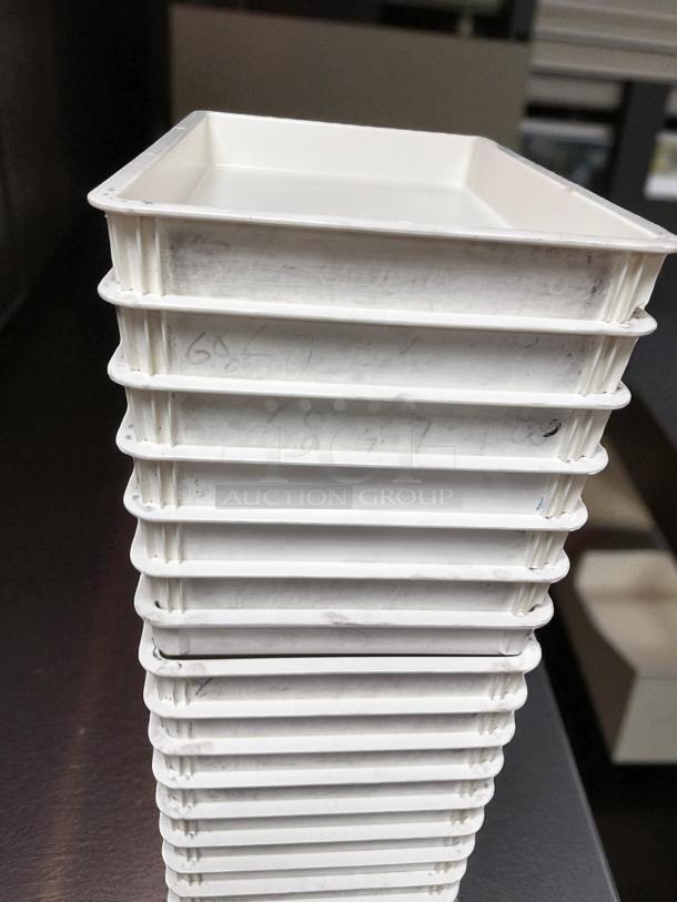 Stack of commercial dough trays, unbranded model, in excellent condition, fully cleaned and ready for use.