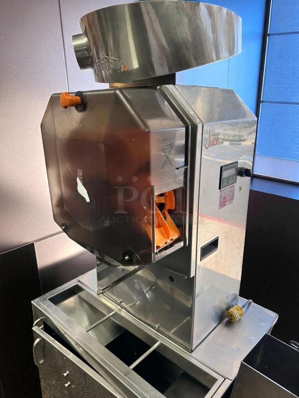 Citrocasa 8000SB automatic orange juicer, in excellent condition, features stainless steel body and operational controls.