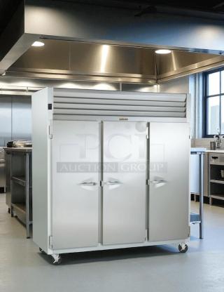 Traulsen 3-Door Commercial Freezer, Model RLT332WUT-FHS, excellent condition, stainless steel, fully tested, on casters.