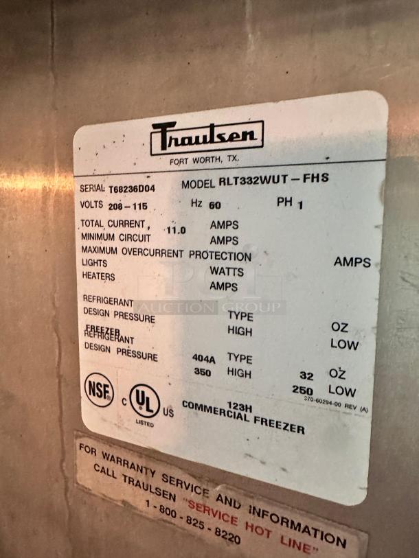 Traulsen 3-door commercial freezer model RLT332WUT-FHS label showing specifications like voltage, refrigerant, and serial number.