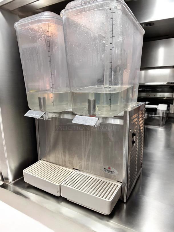 Crathco D25-3 beverage dispenser in excellent condition. Dual containers, clear markings, Crathco logo visible, fully operational.