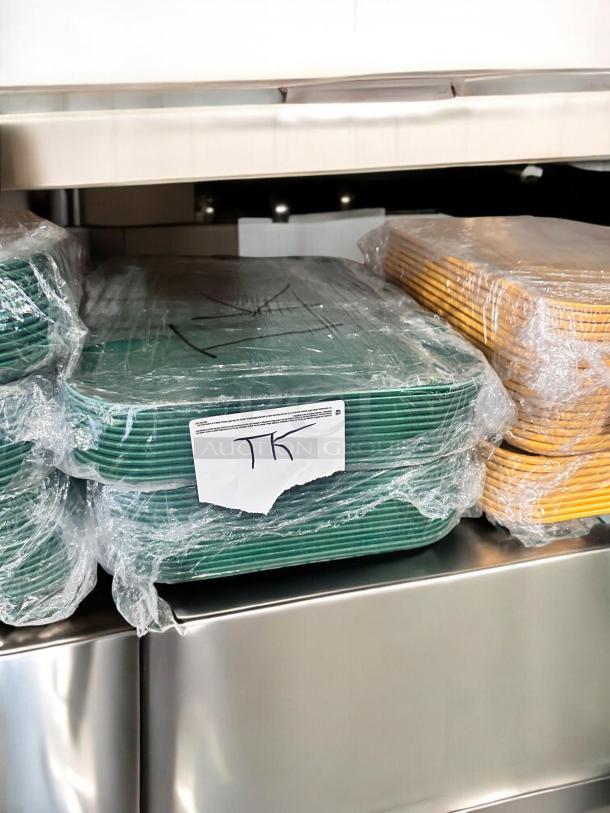 Cambro Camtray® food service trays in green and yellow, Model 23-3, excellent condition, NSF certified, wrapped for protection.