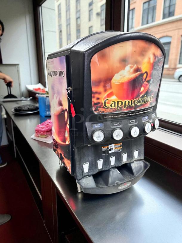 Grindmaster P106W coffee brewer in excellent condition, tested and fully working. Features cappuccino label and multiple dispensing options.