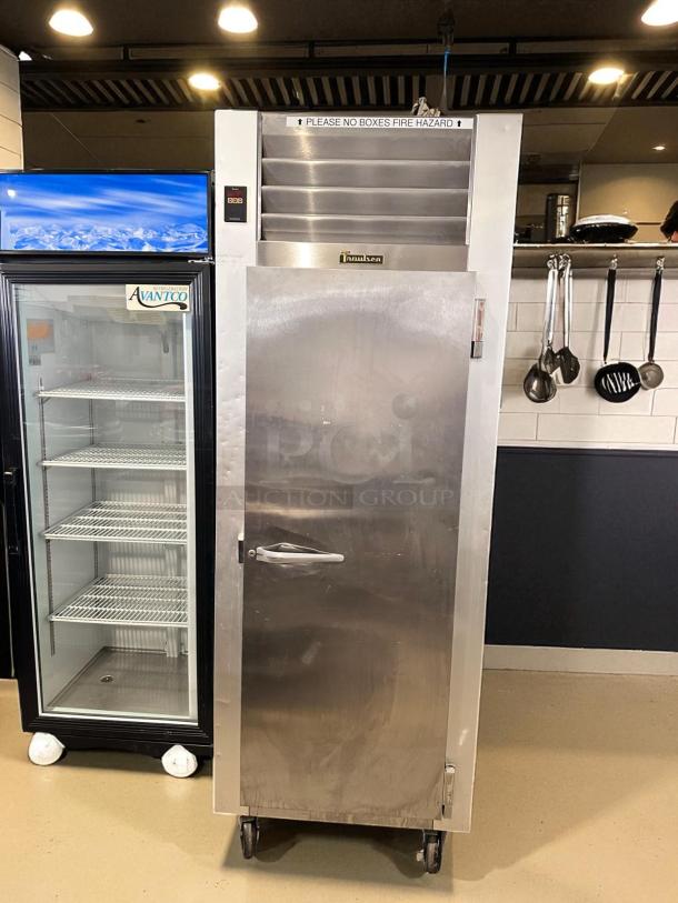 Traulsen G10010 commercial refrigerator, 115V, excellent condition, fully tested. Silver finish, single door, on wheels.