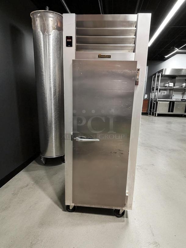 Traulsen G12010 commercial freezer in excellent condition, stainless steel, fully tested and working, visible brand label.