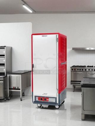 Metro C539-HFS-U heated holding cabinet in excellent condition, red and white, fully tested and working, on casters.