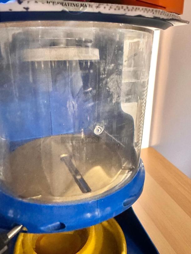 Great Northern Polar Pal ice shaving machine in excellent condition with blue and yellow accents, fully tested and working.