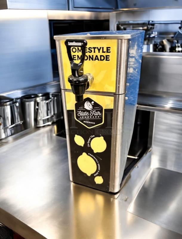 Brand new Ronnoco State Fair Lemonade Dispenser, model FPM-1 by Newco Enterprises, in flawless stainless steel condition.