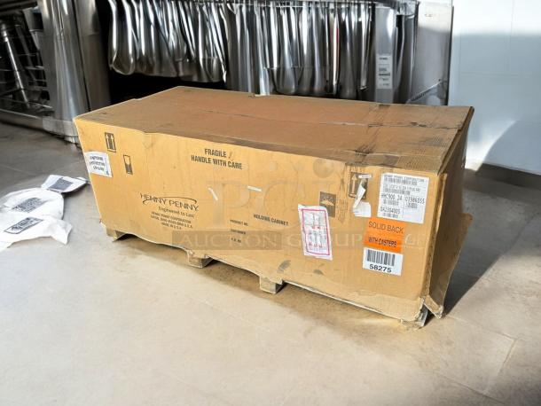 Brand New Henny Penny HHC900.24 full-height heated holding cabinet in factory-sealed box, solid back with casters visible.