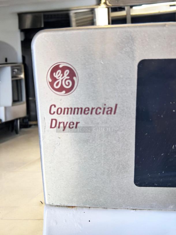 GE DCCD330ED2WC commercial electric dryer, excellent condition, 240V, fully tested. GE logo and "Commercial Dryer" label visible.