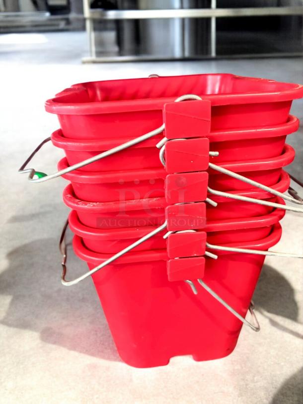 Red Commercial Foodservice NSF sanitizer utility pails in superb condition, stacked and ready for use, featuring durable metal handles.