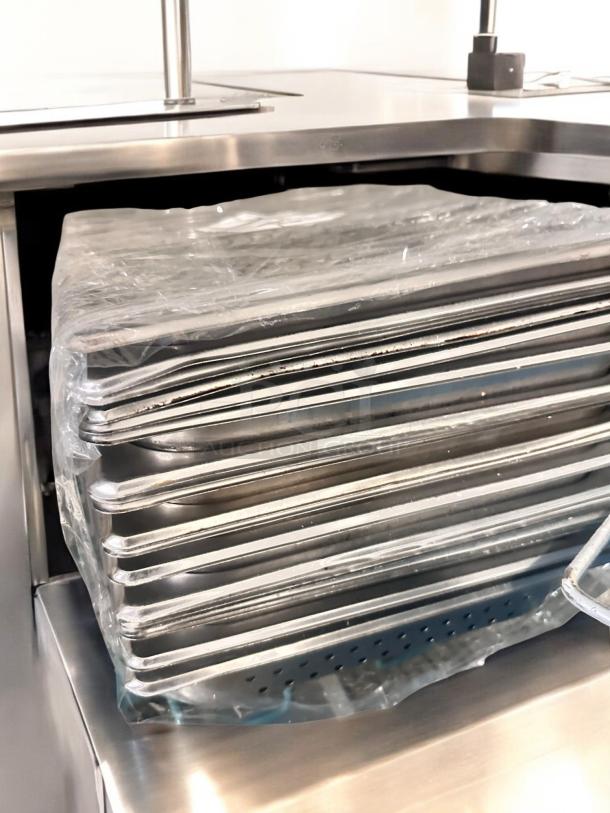 Lot of full-size stainless steel hotel pans by Commercial Foodservice, solid and perforated, superb condition, NSF certified.