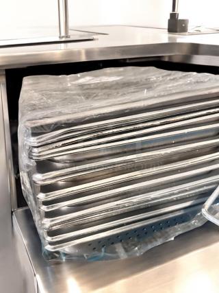 Lot of full-size stainless steel hotel pans by Commercial Foodservice, solid and perforated, superb condition, NSF certified.