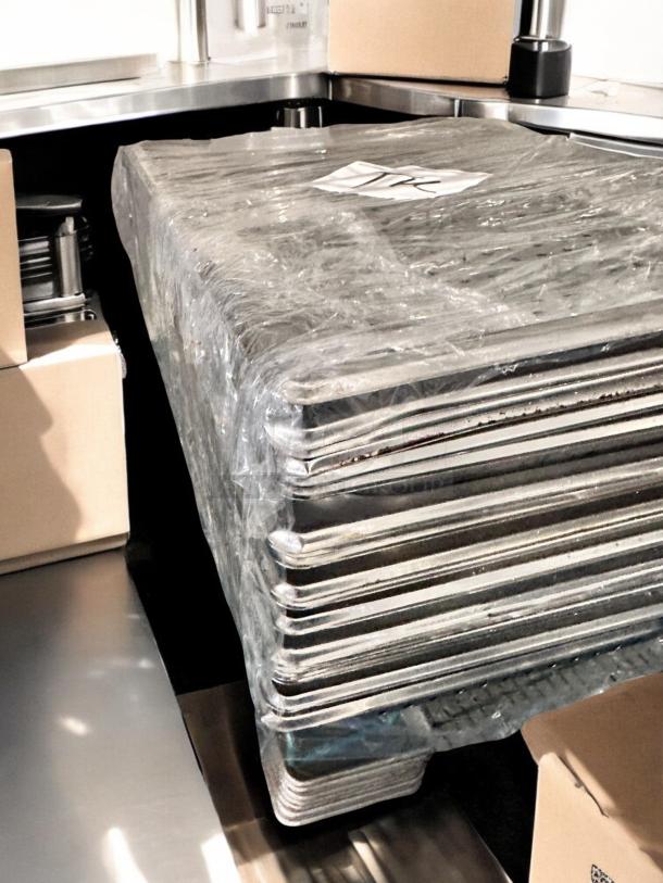 Lot of full-size stainless steel hotel pans, solid and perforated, wrapped in plastic. Superb condition, NSF certified.