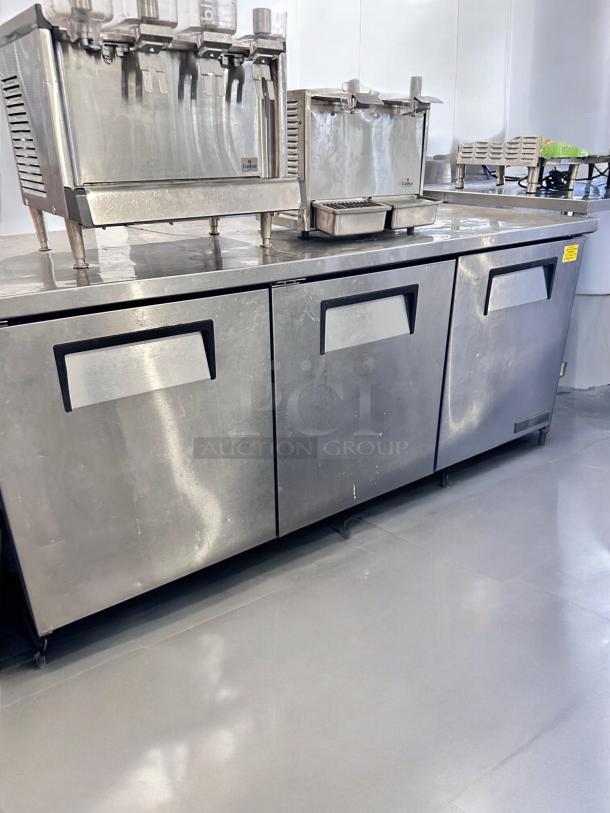 True TWT-93 93" 3-Door Worktop Refrigerator in excellent condition; fully tested and operational with a stainless steel finish.