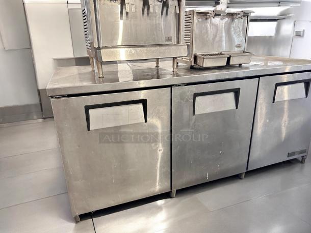 True TWT-93 93" 3-door worktop refrigerator in excellent condition, fully tested and operational, with stainless steel finish.